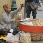 Seller Weighing Peanuts - Log, Colour and B&W