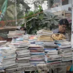 Man Checking Books Cart - Log, Colour and B&W
