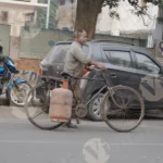 Cooking Gas LPG Cylinder Delivery Guy - Log, Colour and B&W