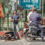 A Man buying belts on Street/Road - Log, Colour and B&W