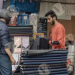 Unstitched Cloth Seller and a Buyer - Log, Colour and B&W