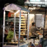 Boy Serving Mayonnaise in a Momos Plater - Log, Colour and B&W