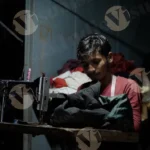 Man Repairing a Jacket in Dark - Log, Colour and B&W