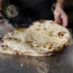 Man Applying Butter on Garlic Naan  - Log, Colour and B&W