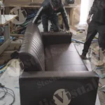 workers assembling sofa - log, colour and B&W