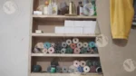 A shelf that holds a variety of threads and tapes - Log, colour and B&W