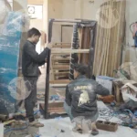 Man making sofa wide shot - Log, colour and B&W