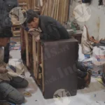 Continue putting nail on wood with drill machine - Log, colour and B&W