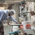 Man applying tape on Wood - Log, colour and B&W