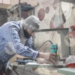 Carpenter shaping wood with a router and creating decorative edges - Log, colour and B&W