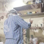 Man working in a factory - Log, colour and B&W