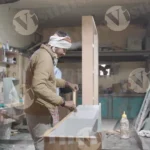 The man is assembling the wooden pieces - Log colour and B&W