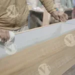 Worker cleaning wood - Log, colour and B&W