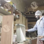 Applying glue on plywood - log, colour and B&W