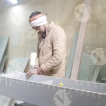 Man tapping shelf - log, colour and B&W