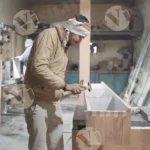 Man fixing shelf - log, colour and B&W