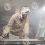 Measuring and cutting wood by a carpenter - log, colour and B&W