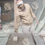 Carpenter cutting plywood - log, colour and B&W