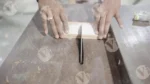 Continue cutting wood close shot - log, colour and B&W