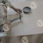 Carpenter hammering nails into plywood - Log, colour and B&W