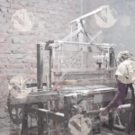 Woman working at a loom, which is a device used for weaving fabric - Log, colour and B&W