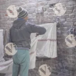 Man folding mop - Log, colour and B&W