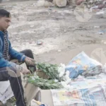 A man preparing flowers - Log, colour and B&W