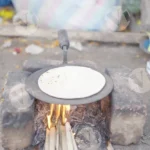 Chapati being cooked over an open fire (Roti) - Log, colour and B&W