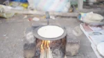 Chapati being cooked over an open fire (Roti) - Log, colour and B&W