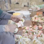 Stringing flowers on thread - Log, colour and B&W
