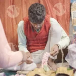 Stringing flowers on thread - Log, colour and B&W