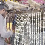 Worker making flower sheets close shot - Log, colour and B&W