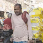 Labour carrying goods - Log, colour and B&W