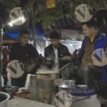 Man making tea on the street - Log, colour and B&W