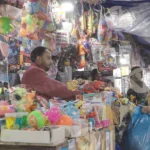 People are buying toys - Log, colour and B&W