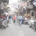 People walking on busy street - Log, colour and B&W