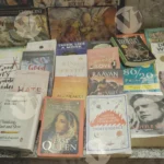 Books displayed for sale in street - Log, colour and B&W