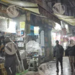 A street scene at night,  with a bookstore ( Darya Ganj) - Log, colour and B&W