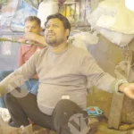 Fish seller talking to coustomer - Log, colour and B&W