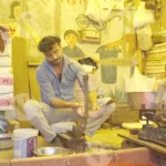 Cleaning fish in fish market- Log, colour and B&W