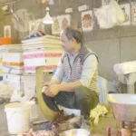 Cleaning fish in market - Log, colour and B&W