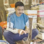 Man cutting fish - Log, colour and B&W