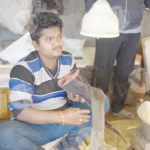 Man selling fish - Log, colour and B&W