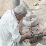 Elderly man, street cobbler, repairing shoes - Log, colour and B&W
