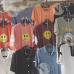 T-shirts Hanging on a Rack in a Street Market - Log, colour and B&W
