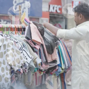 Man Selling Clothes on The Street - Log, colour and B&W