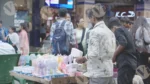 A Man Selling Mini Hand Fan - Log colour and B &W