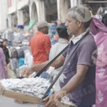 Man Selling Things - Log, colour and B&W
