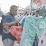 Men Selling Cloth on Market - Log, colour and B&W
