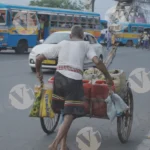 A Man Pulling a Cart on a Street - Log, colour and B&W